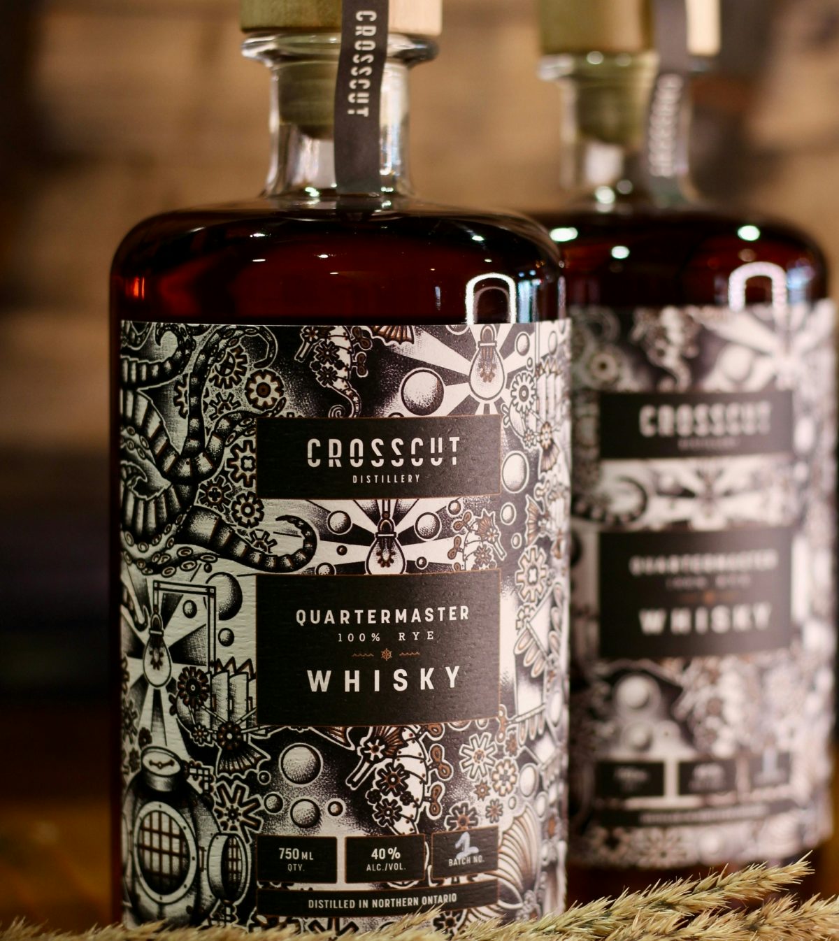 Two Clockwork Four Grain Whisky Gin bottles from Crosscut Distillery displayed on a shelf