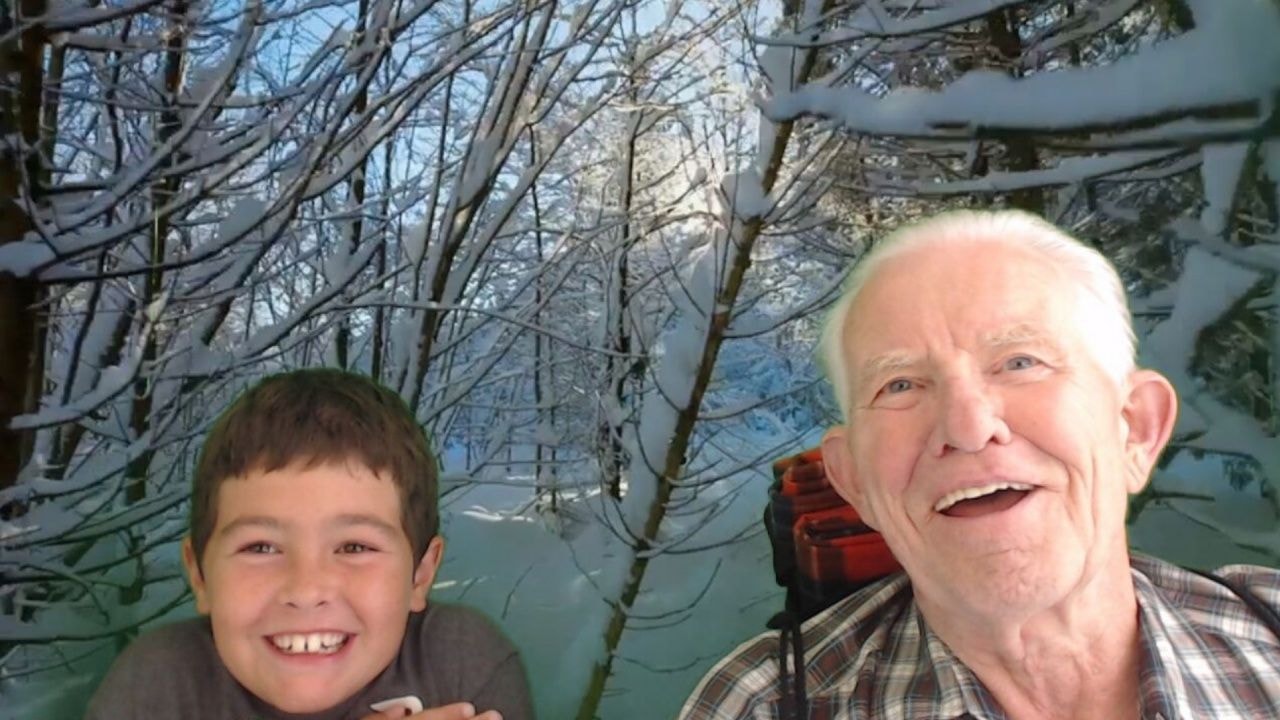 Grandfather and grandson enjoying the Champlain1615 interactive booth