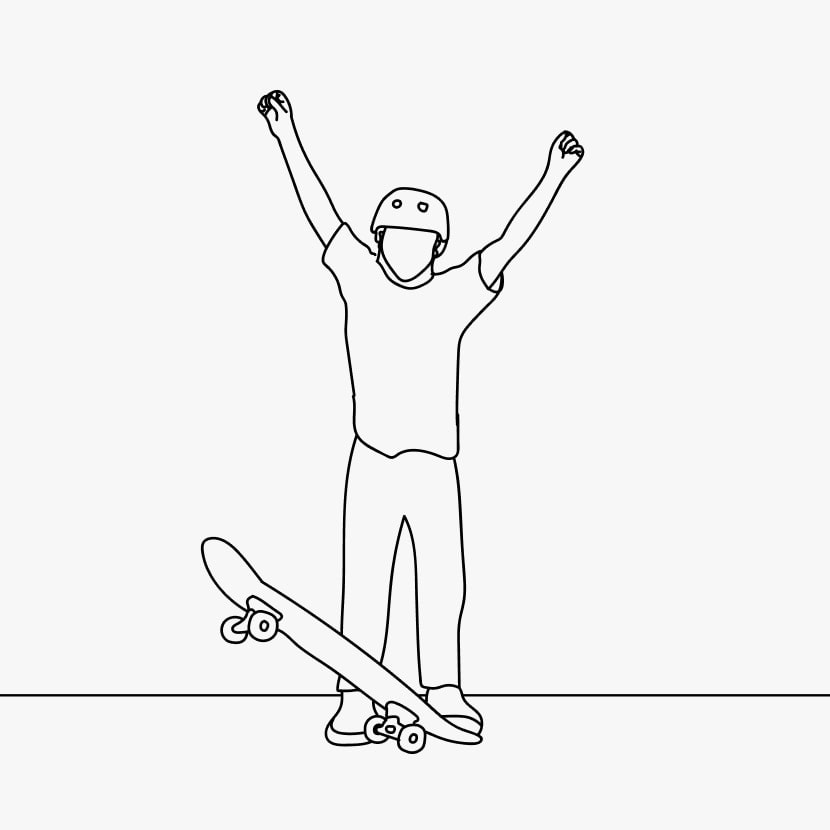 Skateboarder standing with skateboard with their hands up in victory