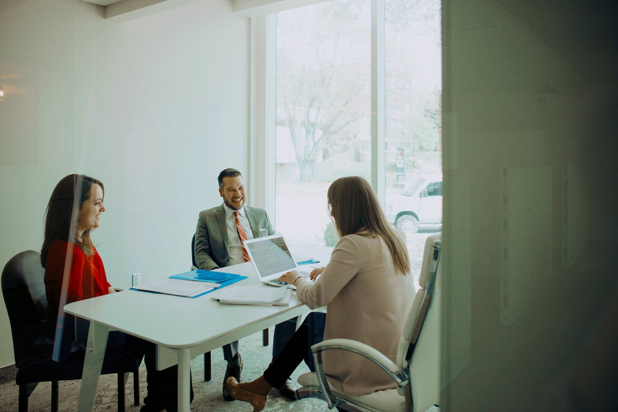 MLA Law partners working in boardroom