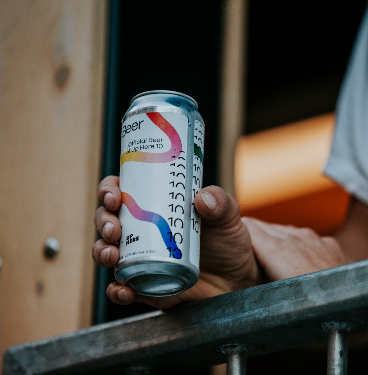 Person holding an Up Here Beer can.