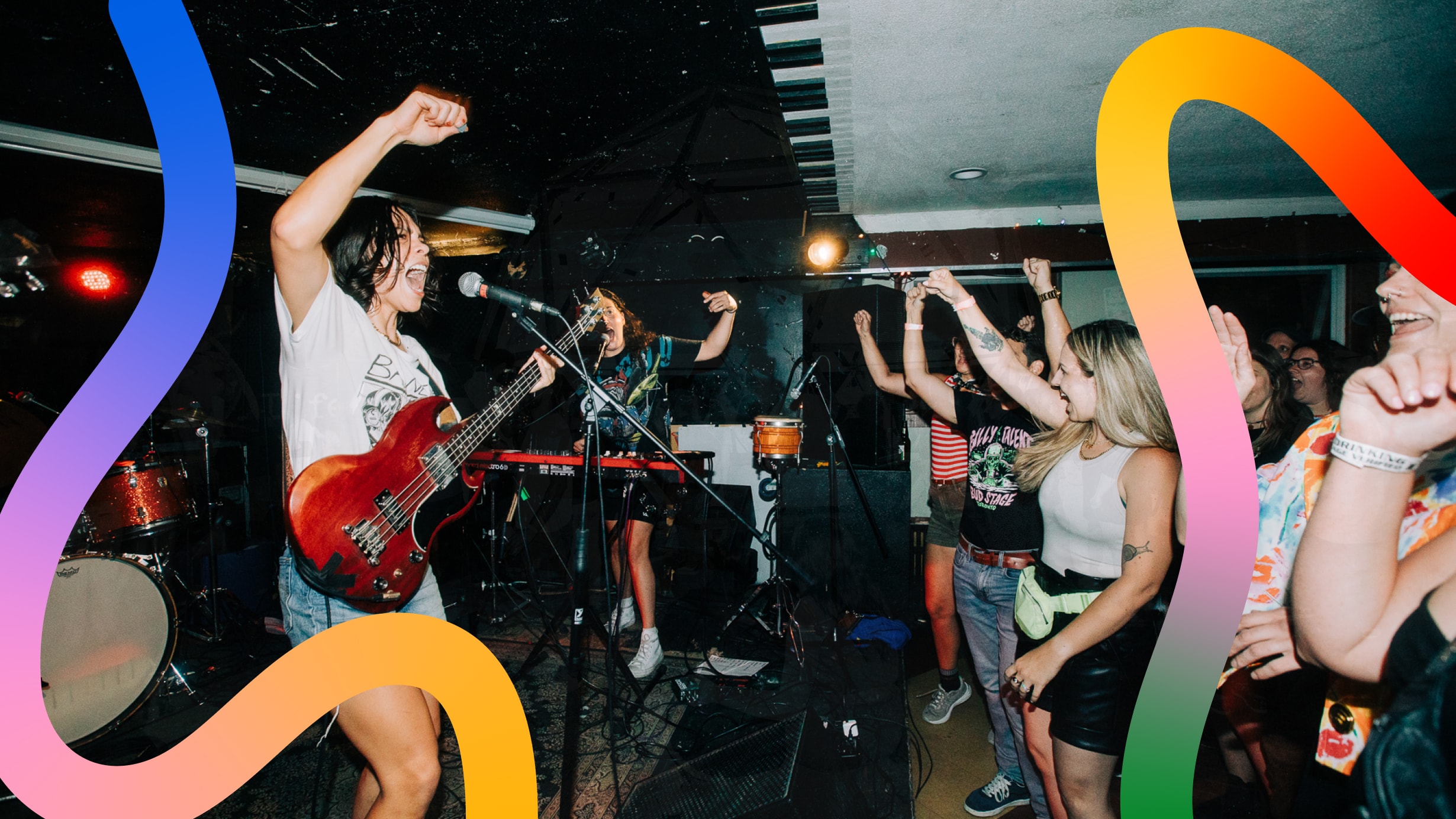 Wavy gradient lines over top of a background of concert performers and attendees cheering.